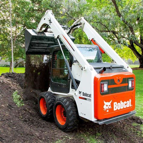 towing a bobcat skid steer|operating a bobcat skid steer.